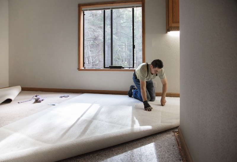 Redicut Carpets worker installing carpets in New Rochelle