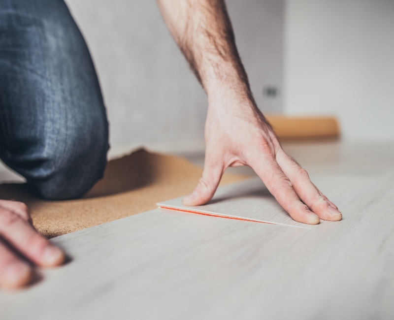 Redi-cut Carpets Worker fitting luxury vinyl at a residence in Mt.Vernon